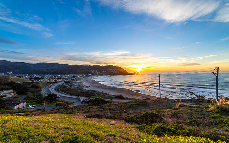 Sunset at Linda Mar beach in Pacifica. Colorful with the ocean and highway 1 in view.