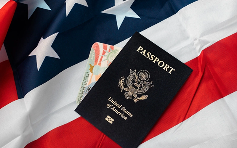 Flat lay of U.S. green card and passport