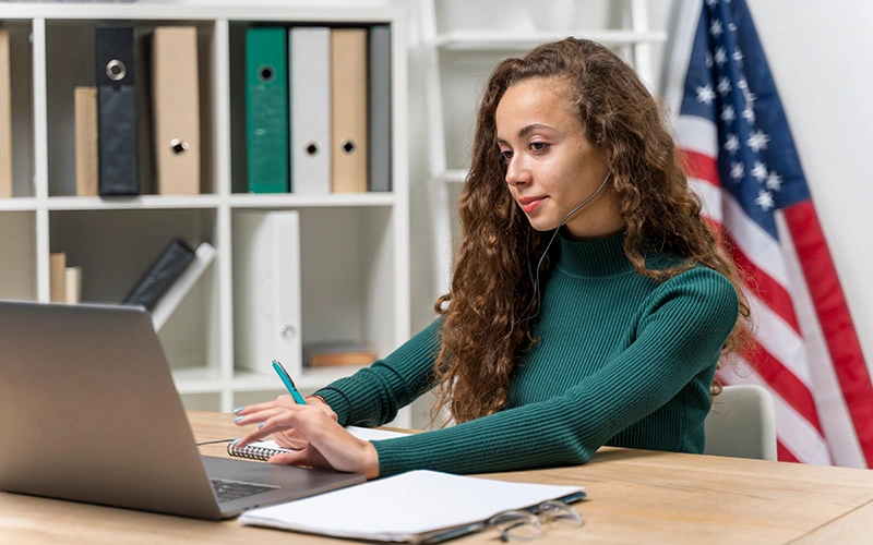 Girl working on a laptop.