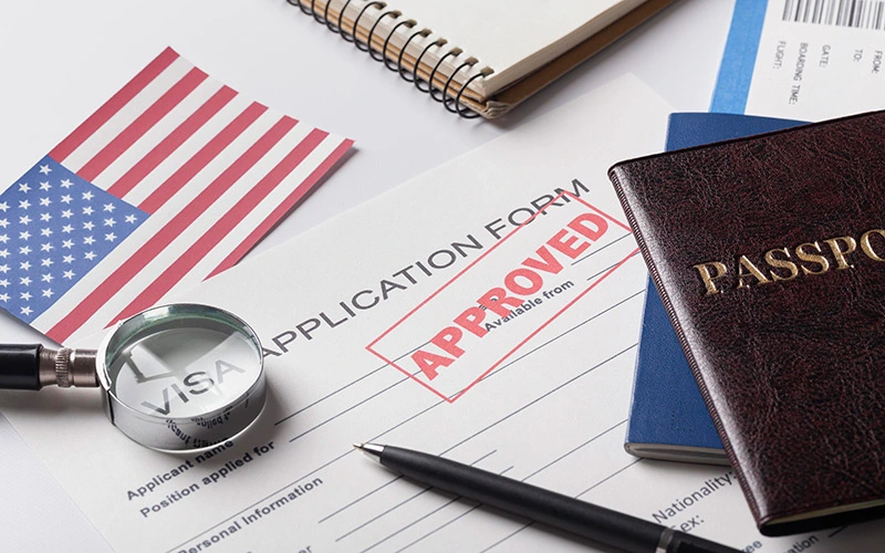 Visa application form with American flag in the background