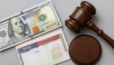 US visa, dollar bill, and gavel for overstay fine